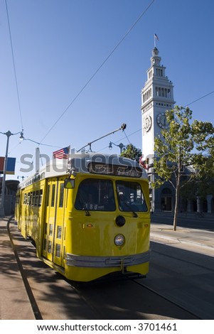 Trolley Yellow with Ferry Building Public transportation in San Francisco California
