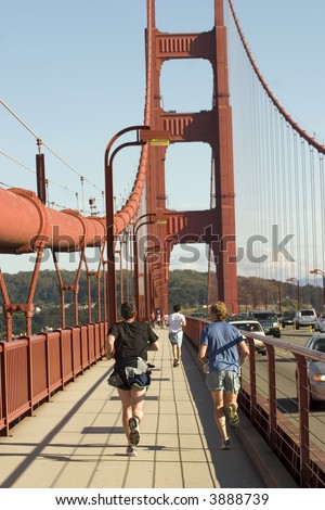 Two man running in Golden Gate Bridge in San Francisco California