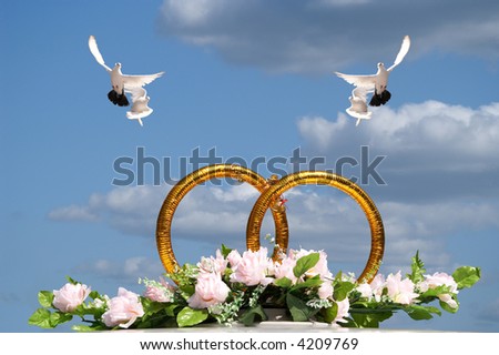 stock photo Rings symbolizing wedding on a background of the lightblue