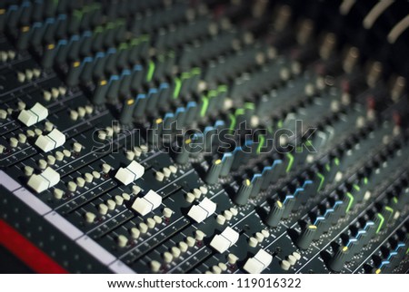 Audio mixing board in a dark room