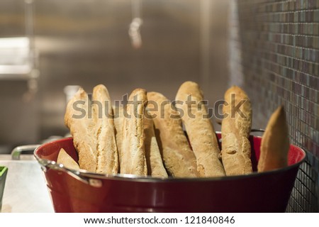 Rustic French bread baguettes ready for serving in restaurant