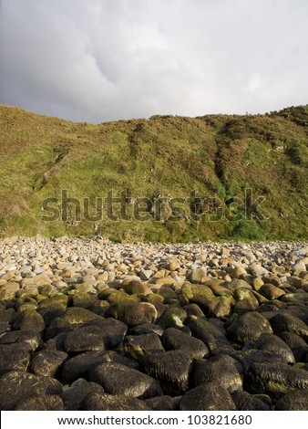 Coastal landscape with mountains, rocks and sky.The photograph was taken at the beach, their backs to the sea