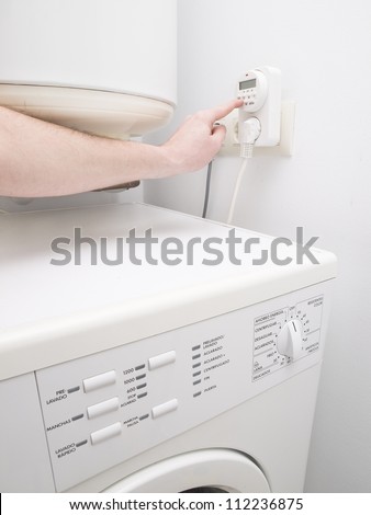 Timer to save energy for domestic purposes and one person programming. The photo also shows a washer
