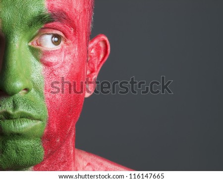 Man face flag Portugal looking at side on isolated background.