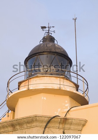 Lighthouse built on a building at sunset. Lighthouse built on a building at sunset. The lighthouse is bathed in evening light and is located in Ferrol, Galicia, Spain.