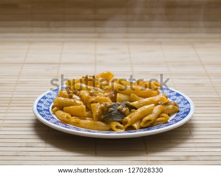Cooked macaroni on bamboo background