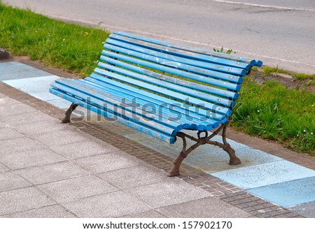 Wooden park bench in nature. A good place to sit