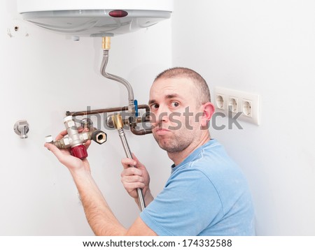 Inexperienced plumber trying to repair an electric water heater