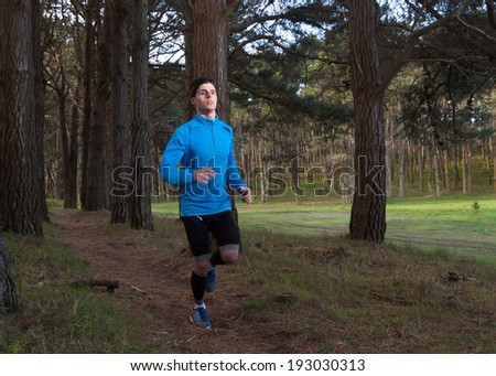 Man running in the forest outdoors