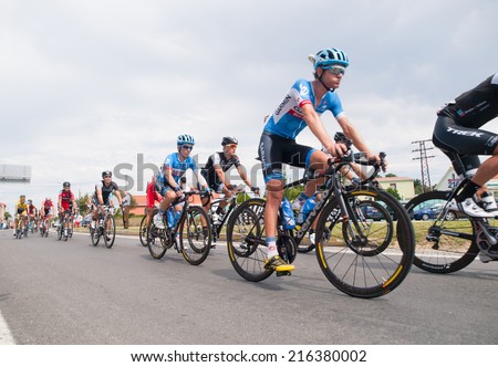 FERROL, SPAIN - SEPTEMBER 10: Unknown racers on the competition Tour of Spain (La Vuelta) on September 10, 2014 in Ferrol, Spain. The photo shows cyclists in a row
