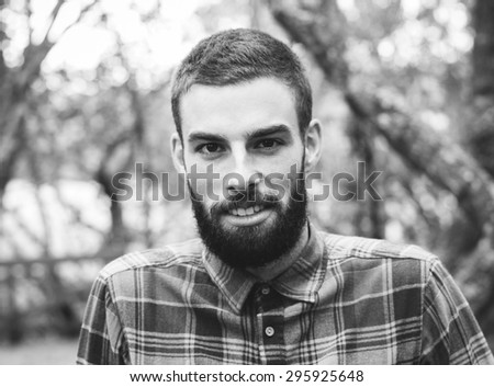 Hipster man portrait  in black and white in horizontal composition.