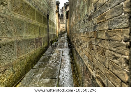 stone alley under rain