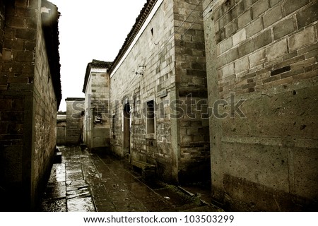 stone alley under rain