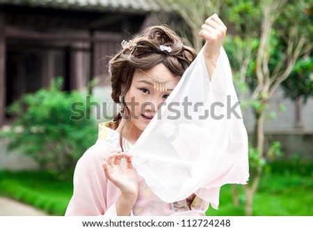 Chinese female model with traditional chinese clothes in the Tang dynasty