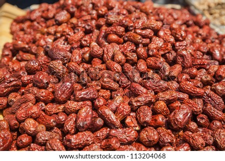 dried red date stacked in the market place