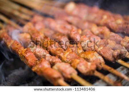 meat shashlik on top of carbon fire