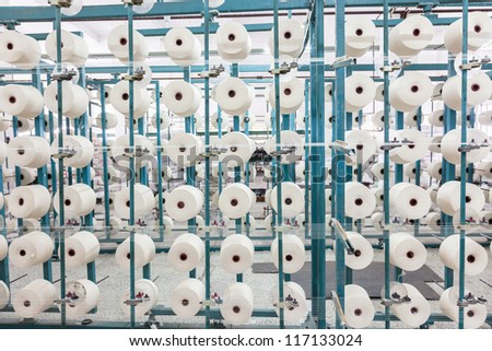 cotton cone stacked in the rack in a yarn factory