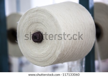 cotton cone stacked in the rack in a yarn factory