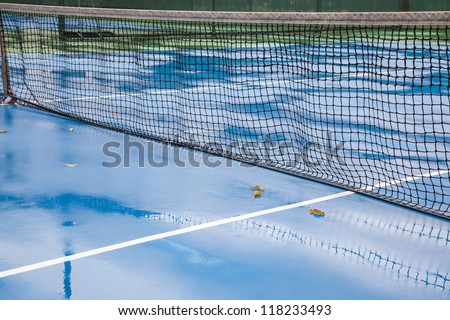 tennis court after rain, with wet floor