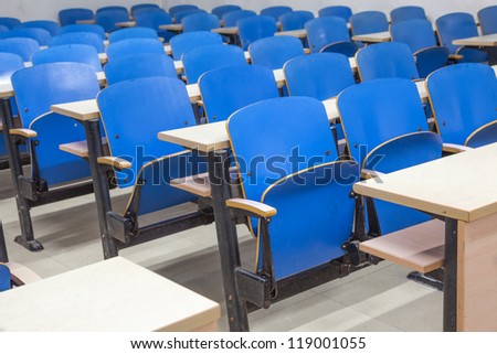 tables and chairs in the empty classroom