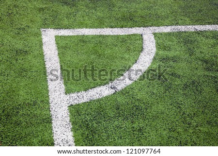 corner in the soccer field, white lines and green grass field
