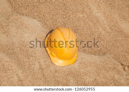 hardhat on top of sand in a construction site