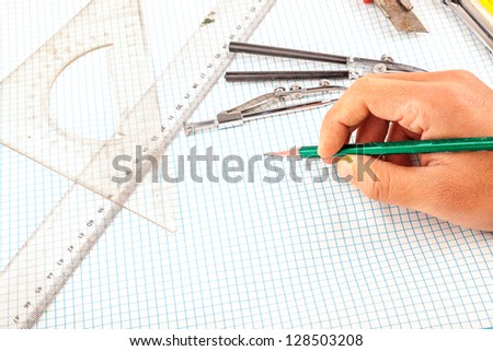 drawing compass in the wooden table drawing compass in the wooden table