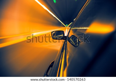 car on tunnel with light path