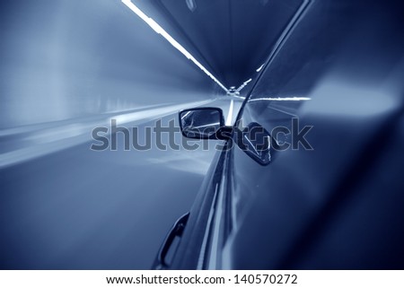 car on tunnel with light path
