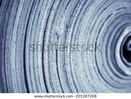 reel of jeans cloth stacked in the factory