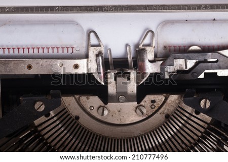type writer with blank white paper