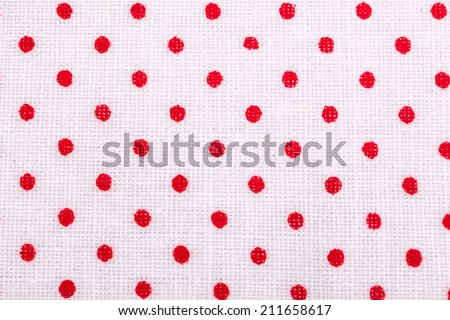 red dots in white textile cloth