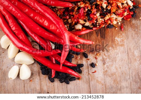 traditional chinese chili sauce making from fresh red chili,fermented soybean and fresh garlic, chopped and mixed for fermentation
