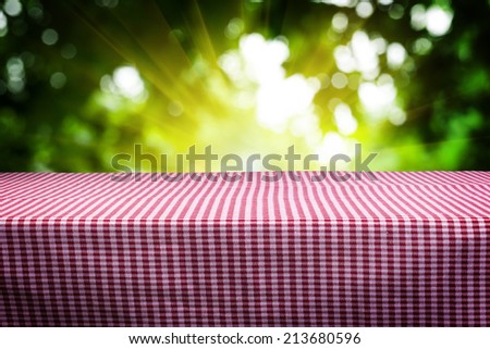 empty table in the park for products presentation