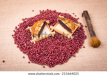 red beans studio shot with moon cake made of red bean paste