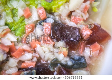 Steamed Chinese Cabbage in Supreme Soup with ham sausage and preserved egg grain soup