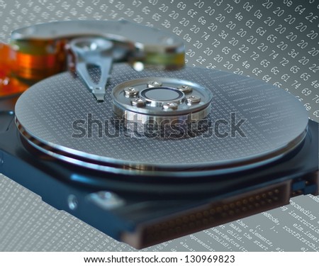 Concept of data storage and safety presented by close up of opened hard disk drive with abstract dump of data or program list reflection. isolated on digital background. Three clipping paths included.