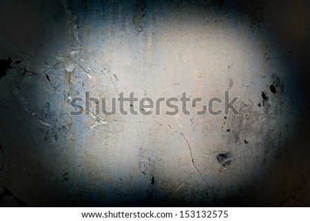 Texture of the old concrete wall highlighted by dim light lamp