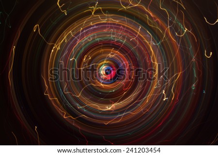 abstract super string concept - colorful spin or rotation high energy space with light curves moved to hole at center