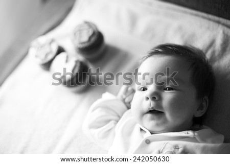 Black and white portrait of laughing baby