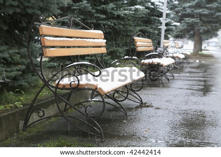 Urban benches. First snow melts been actively