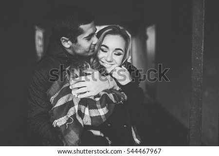 Lovely happy couple.romantic black and white photo.Hugs together and smile