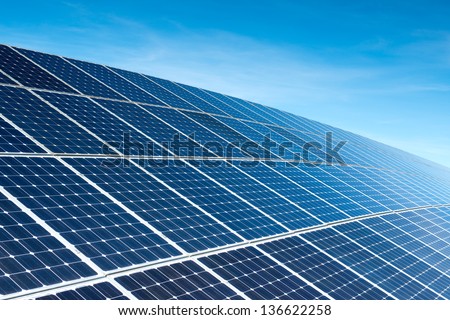 Solar Panels Against The Deep Blue Sky