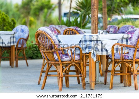 Nice Tables And Chairs In A Greek Tavern in Georgioupolis, Island of Crete, Greece