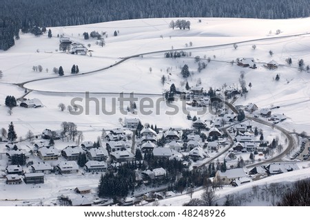 View over a little village in the Black-Forest (Germany), covered in snow during winter.
