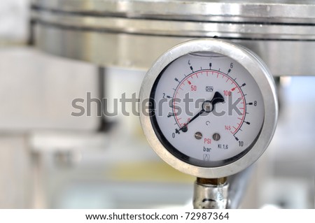Closeup of a pressure meter on a machine