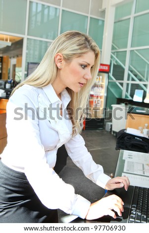 A beautiful office lady checking information on computer