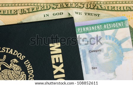 Permanent Resident - Green Card. A permanent resident card - Green card and a passport of Mexico. On the background a dollar bill from the United States of America