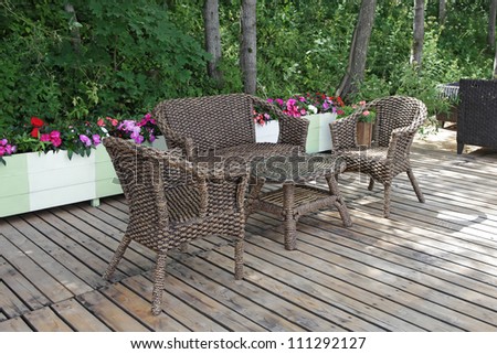 Rattan chairs and table  in empty cafe