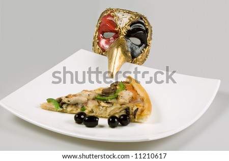 Slice of pizza with olives and italian mask.